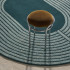 Tapis ovale en laine Mirage Maison Sarah Lavoine, lignes concentriques en relief autour d'un ovale central